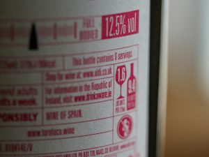 Detailed image of a wine bottle label showing 12.5% alcohol content and serving information.